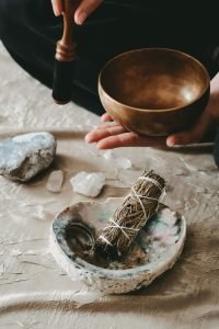 Girl holding a gold Tibetan bowl during a holistic sound healing ritual ✦ Snag more FREE stock photos each month 👉 https://contentpixie.com/secret-snaps/